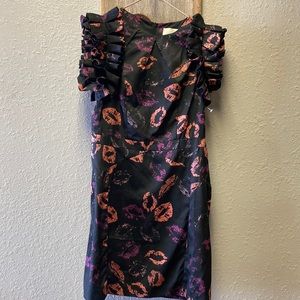 Fun print with kisses.  Size small with pink and purple  kisses